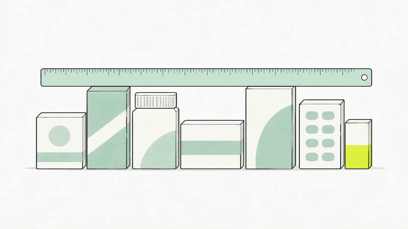 Illustration: Lineal liegt quer über einer Reihe unterschiedlich hoher Medikamentenschachteln